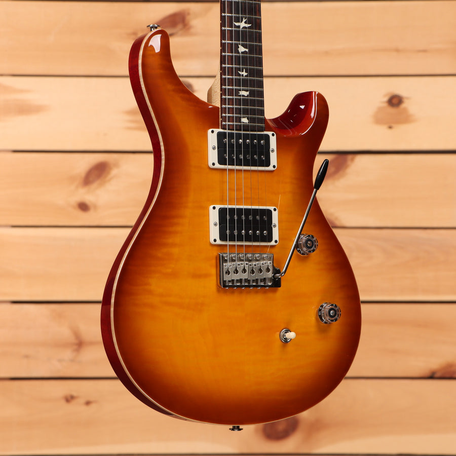 PRS CE-24 electric guitar McCarty Burst flamed maple top with dual humbuckers and tremolo bridge