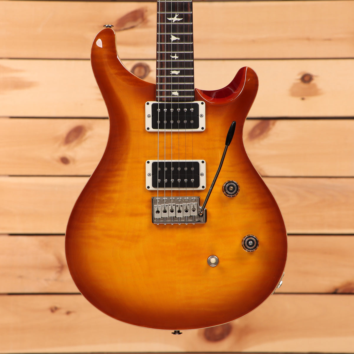 PRS CE-24 electric guitar McCarty Burst flamed maple top with dual humbuckers and tremolo bridge