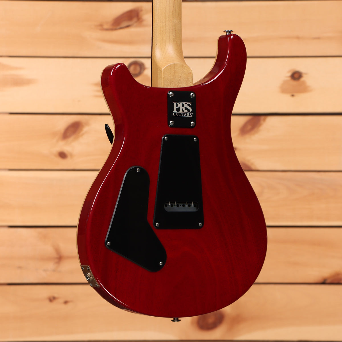 PRS CE-24 electric guitar McCarty Burst with maple neck and black tremolo cavity cover back view