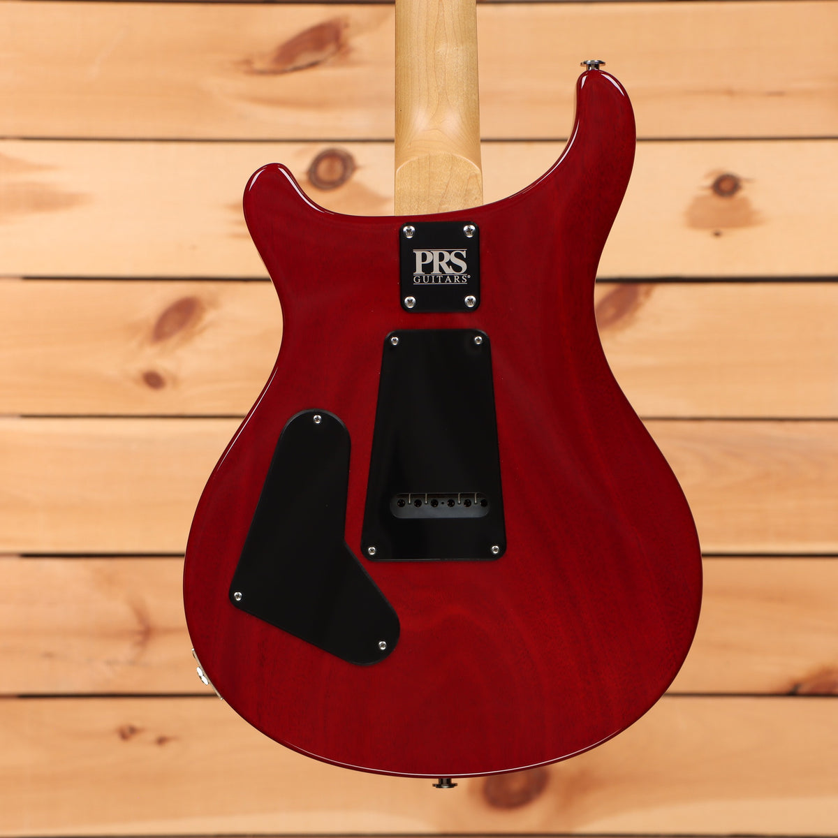 PRS CE-24 electric guitar McCarty Burst showing maple neck and tremolo cavity back with black control covers
