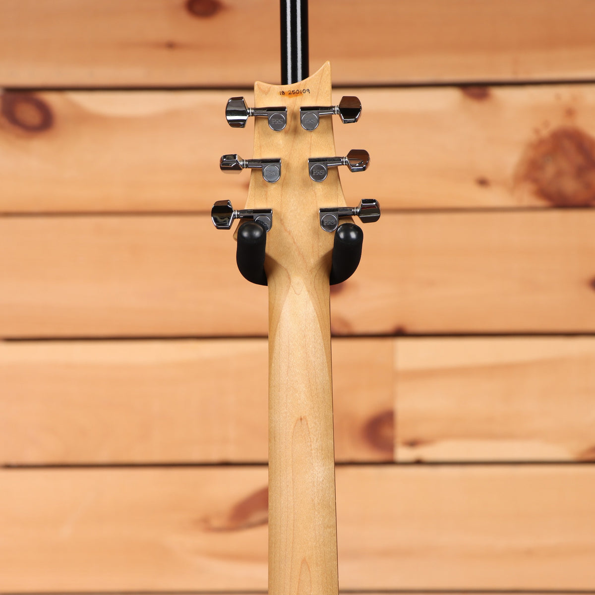 PRS CE-24 McCarty Burst electric guitar rear headstock view with maple neck and chrome PRS tuners