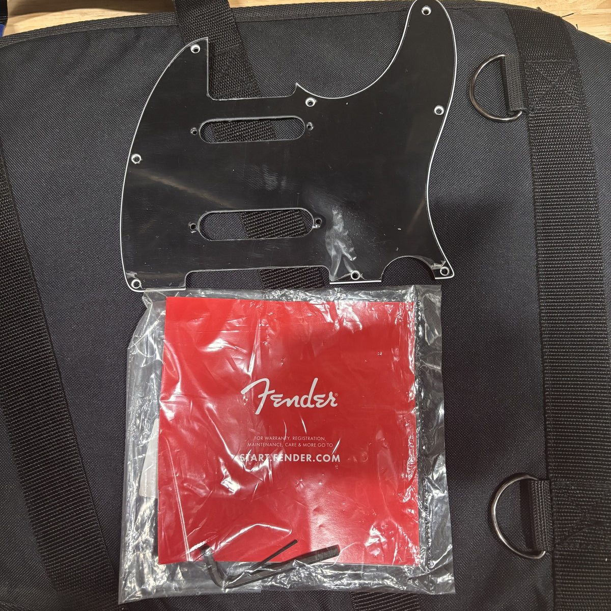 Fender Player Plus Nashville Telecaster Butterscotch Blonde accessories including pickguard and documentation in gig bag