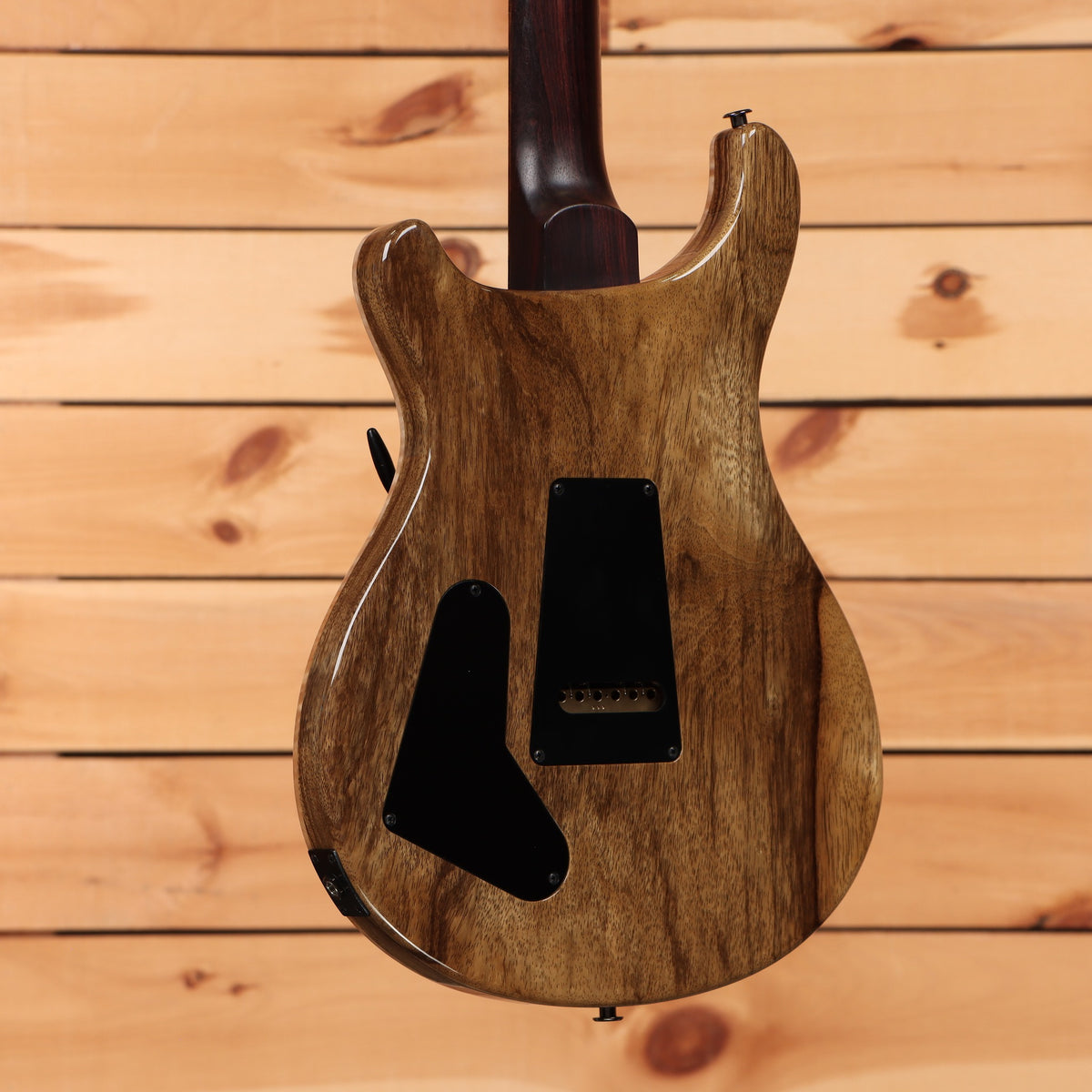 PRS Special Semi-Hollow electric guitar Purple Sparkle showing natural walnut back with black hardware and cavity covers