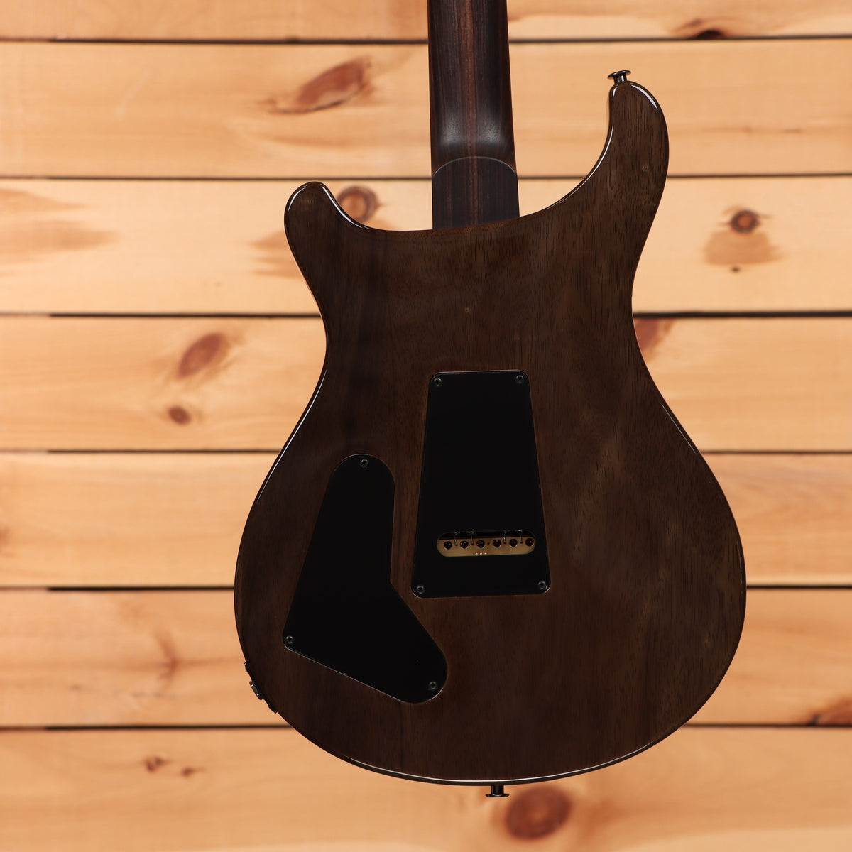 PRS Special Semi-Hollow electric guitar Fuschia finish showing mahogany back with black cavity covers and gold hardware