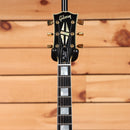 Gibson 1968 Les Paul Custom Reissue Light Aged Ebony electric guitar headstock with gold tuners and block inlays