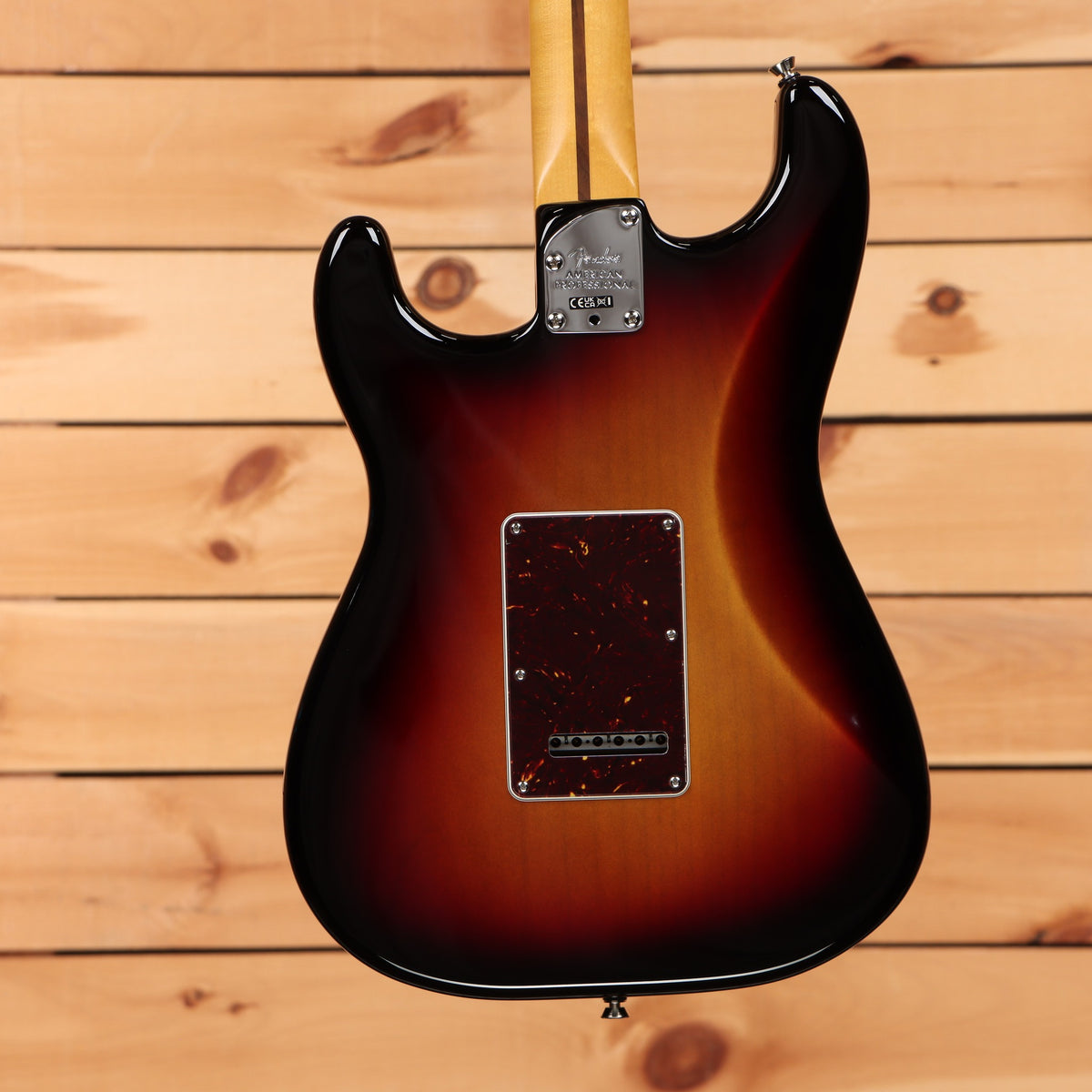 Fender American Professional Stratocaster electric guitar 3-Tone Sunburst showing maple neck and tortoiseshell tremolo back p