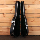 Martin D-28 dreadnought acoustic guitar hardshell case black with silver hardware latches open view
