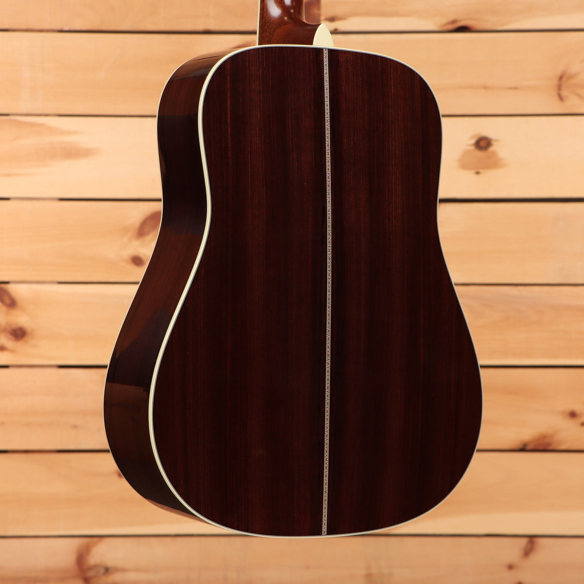 Martin D-41 dreadnought acoustic guitar Natural with Aging Toner featuring rosewood back with herringbone center seam inlay