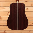 Martin D-41 dreadnought acoustic guitar Natural with Aging Toner featuring rosewood back with herringbone center strip bindin