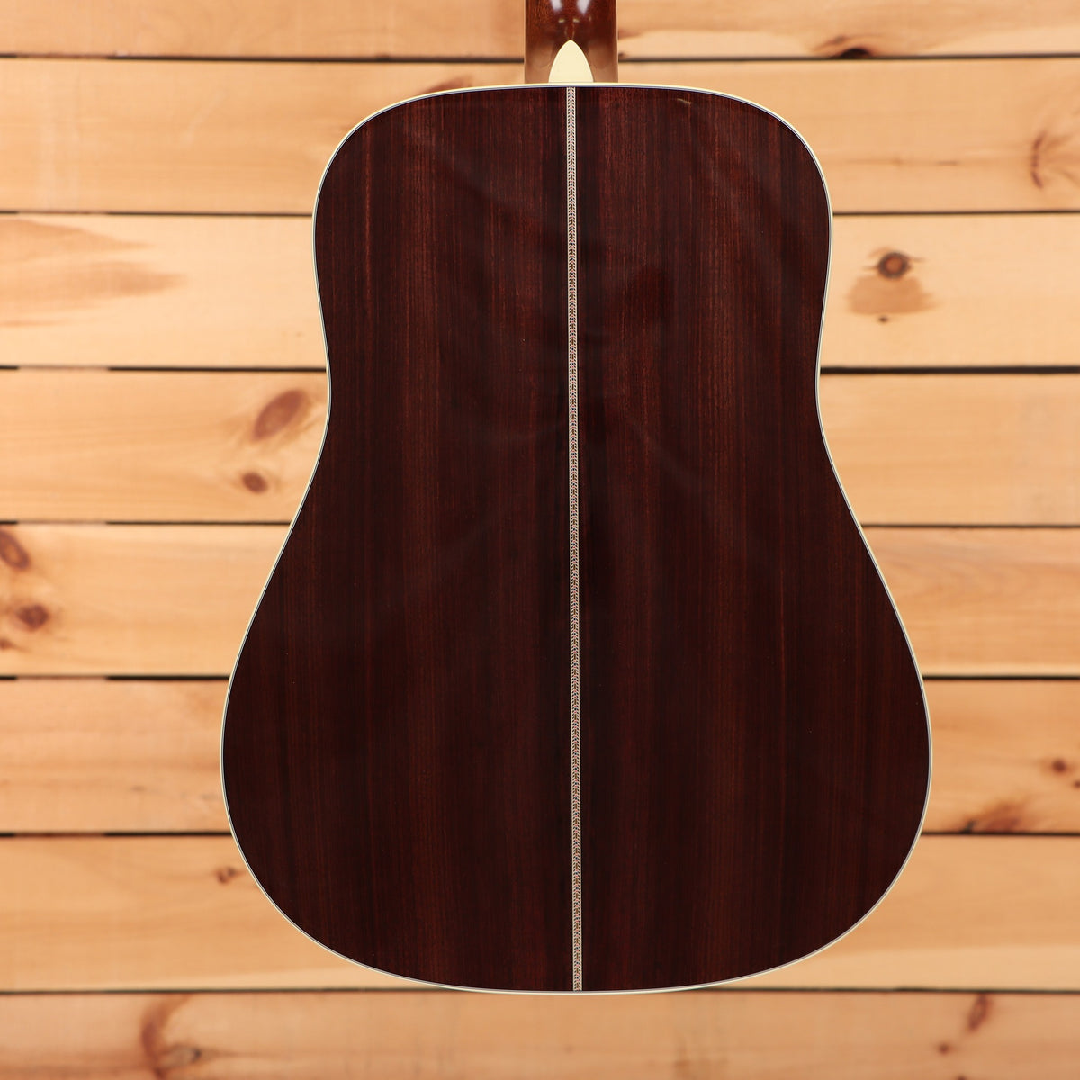 Martin D-41 dreadnought acoustic guitar Natural with Aging Toner featuring rosewood back with herringbone center strip bindin
