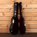 Martin CEO-7 acoustic guitar hardshell case open black exterior red velvet interior with gold hardware latches