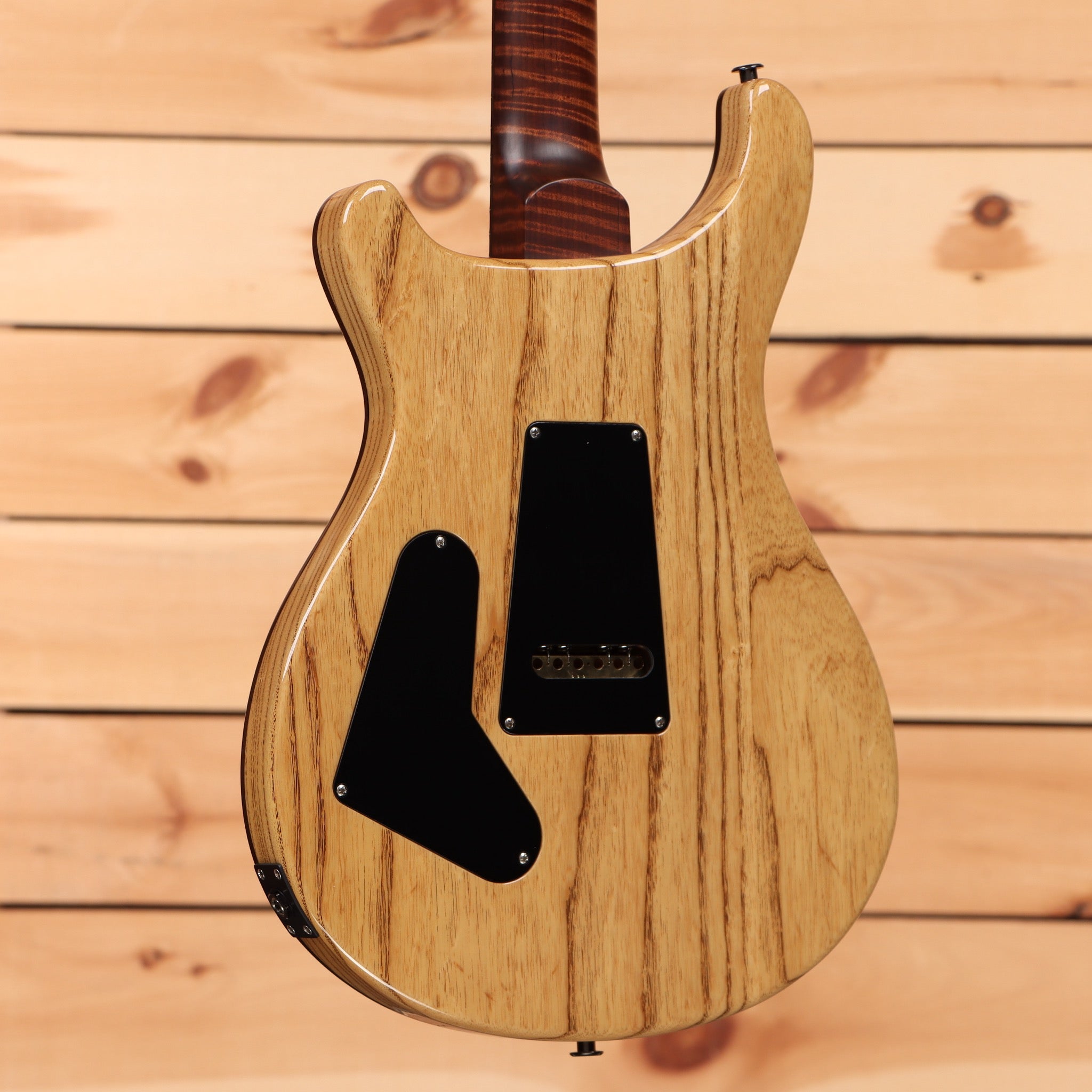 Paul Reed Smith Custom 24 Wood Library electric guitar Copperhead Burst with black pickguard and figured wood grain body