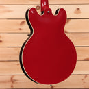 Gibson ES-335 semi-hollow electric guitar Cardinal Red with white binding and dual humbuckers