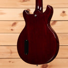 Gibson 1958 Les Paul Junior Double-Cut VOS electric guitar Cherry Red with P90 pickup and semi-hollow body cutaway design