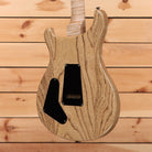 Paul Reed Smith Special semi-hollow electric guitar natural wood grain finish with black pickguard