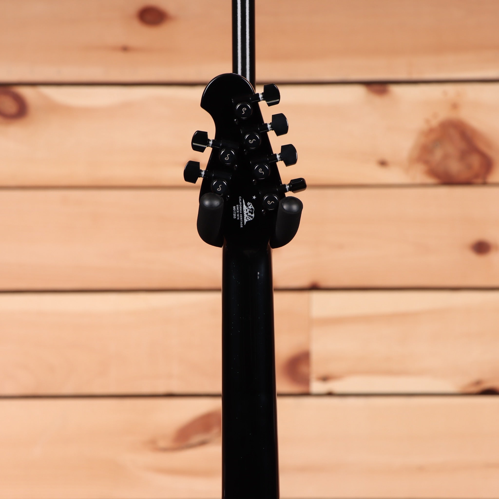 Ernie Ball Music Man Majesty 6 electric guitar Emerald Sky with black headstock and tuning machines