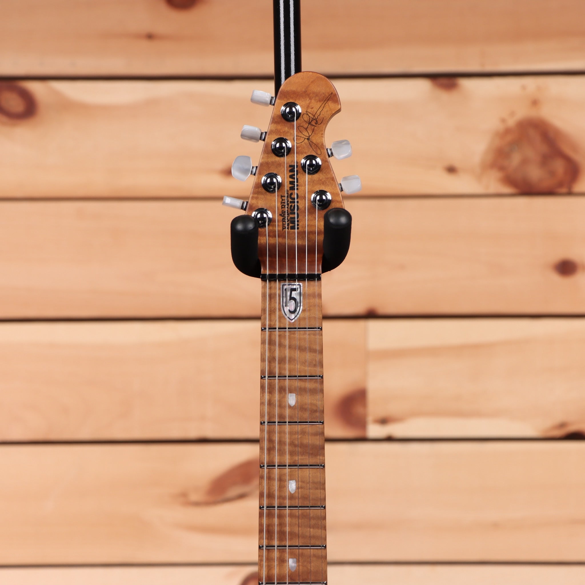 Ernie Ball Music Man JP15 Tiger Eye Quilt electric guitar with maple neck and black pickguard