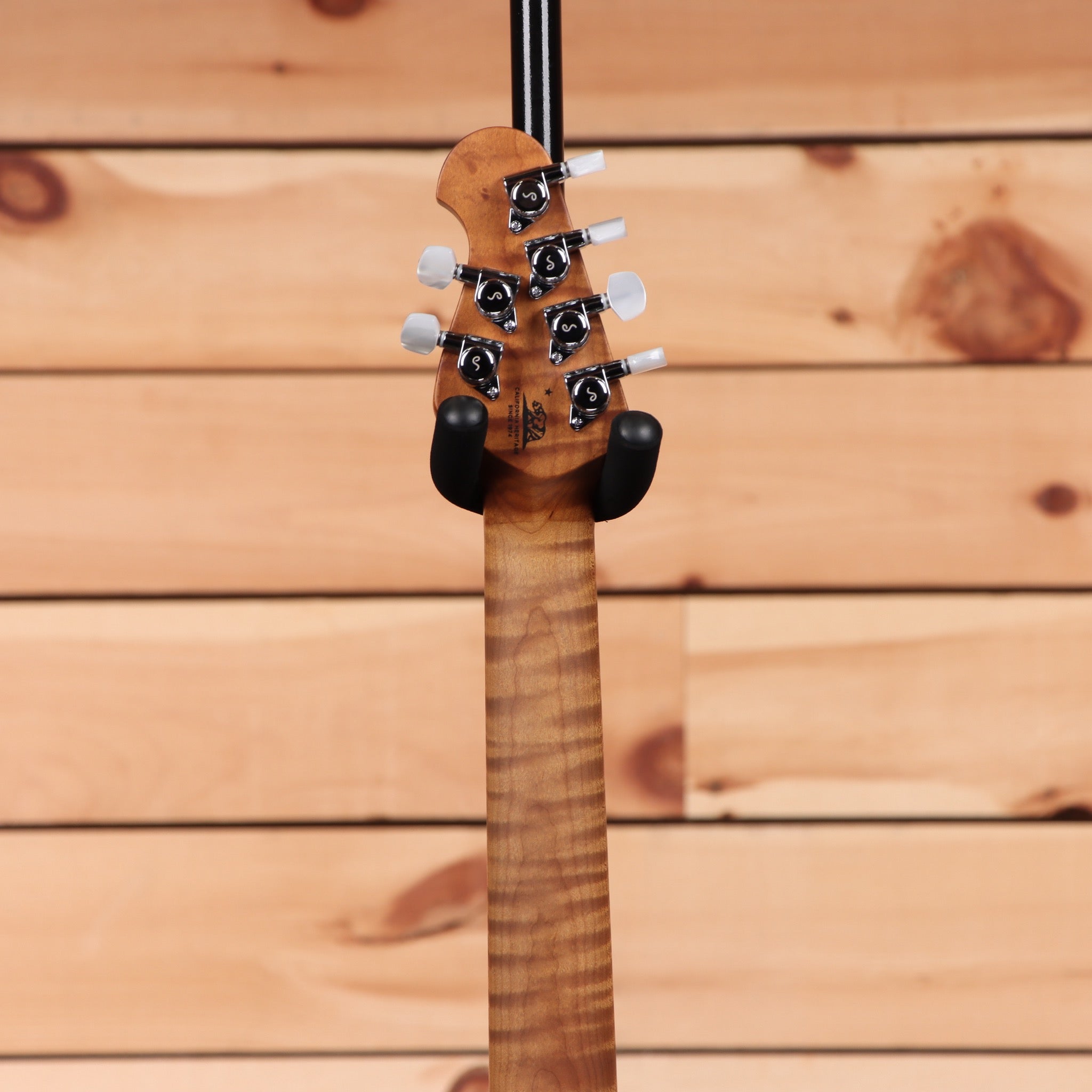 Ernie Ball Music Man JP15 electric bass tiger eye quilt maple top with black hardware