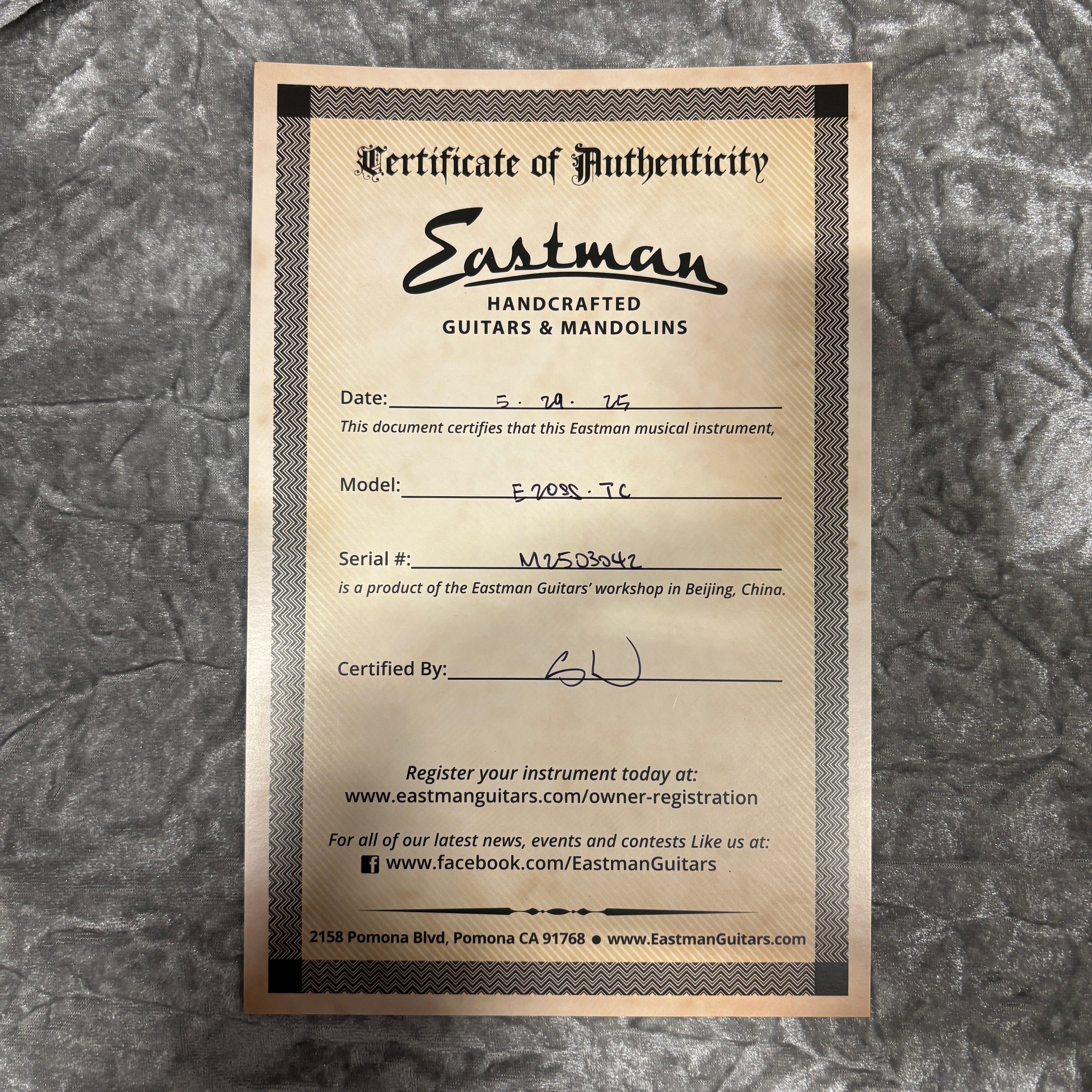 Eastman E20SS-TC handcrafted acoustic guitar sunburst finish Certificate of Authenticity document