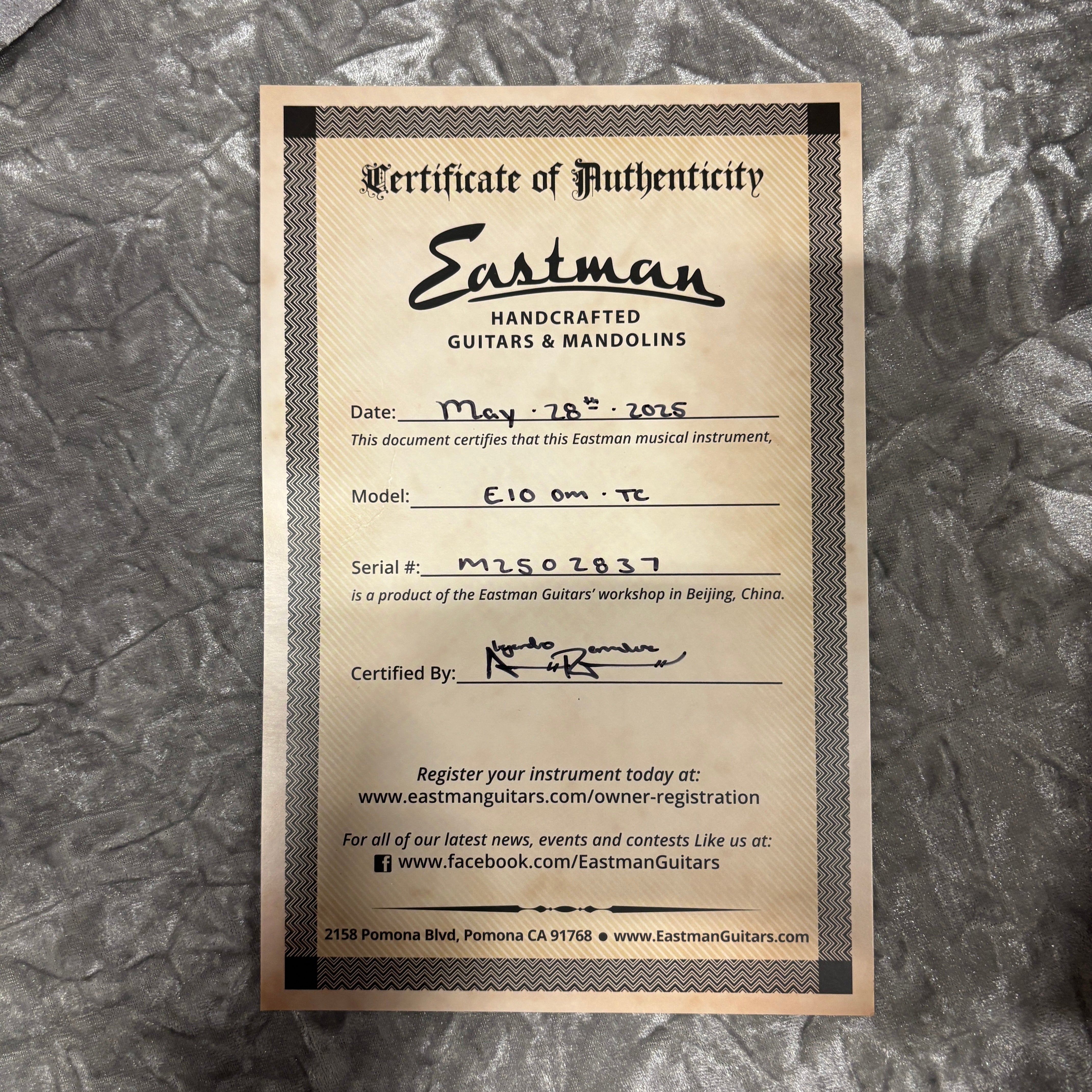 Eastman E10OM-TC natural mandolin certificate of authenticity with serial number MLS02837