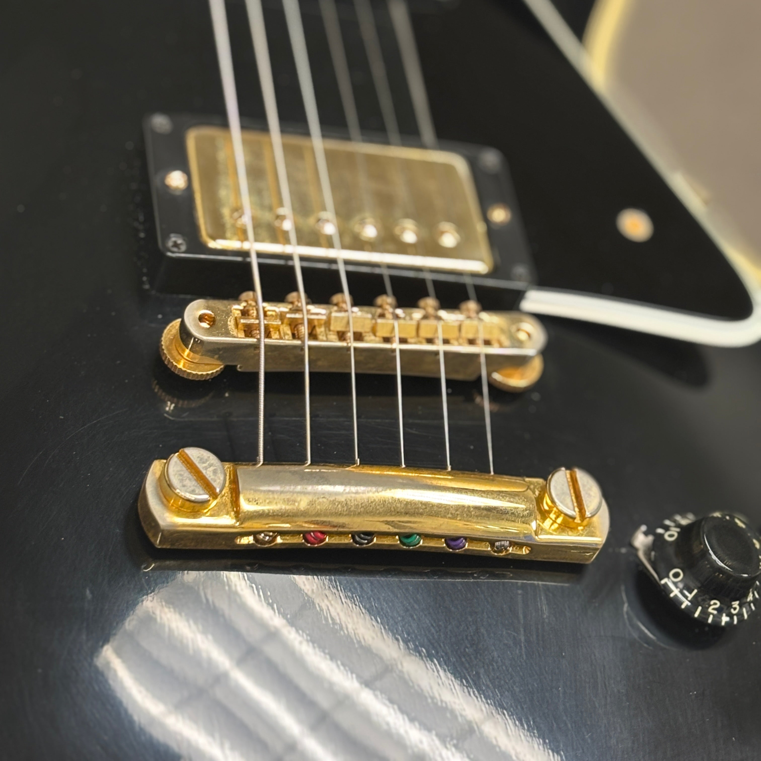 Pre-owned Gibson 1957 Les Paul Custom Reissue VOS Ebony electric guitar with gold hardware and humbucker pickups