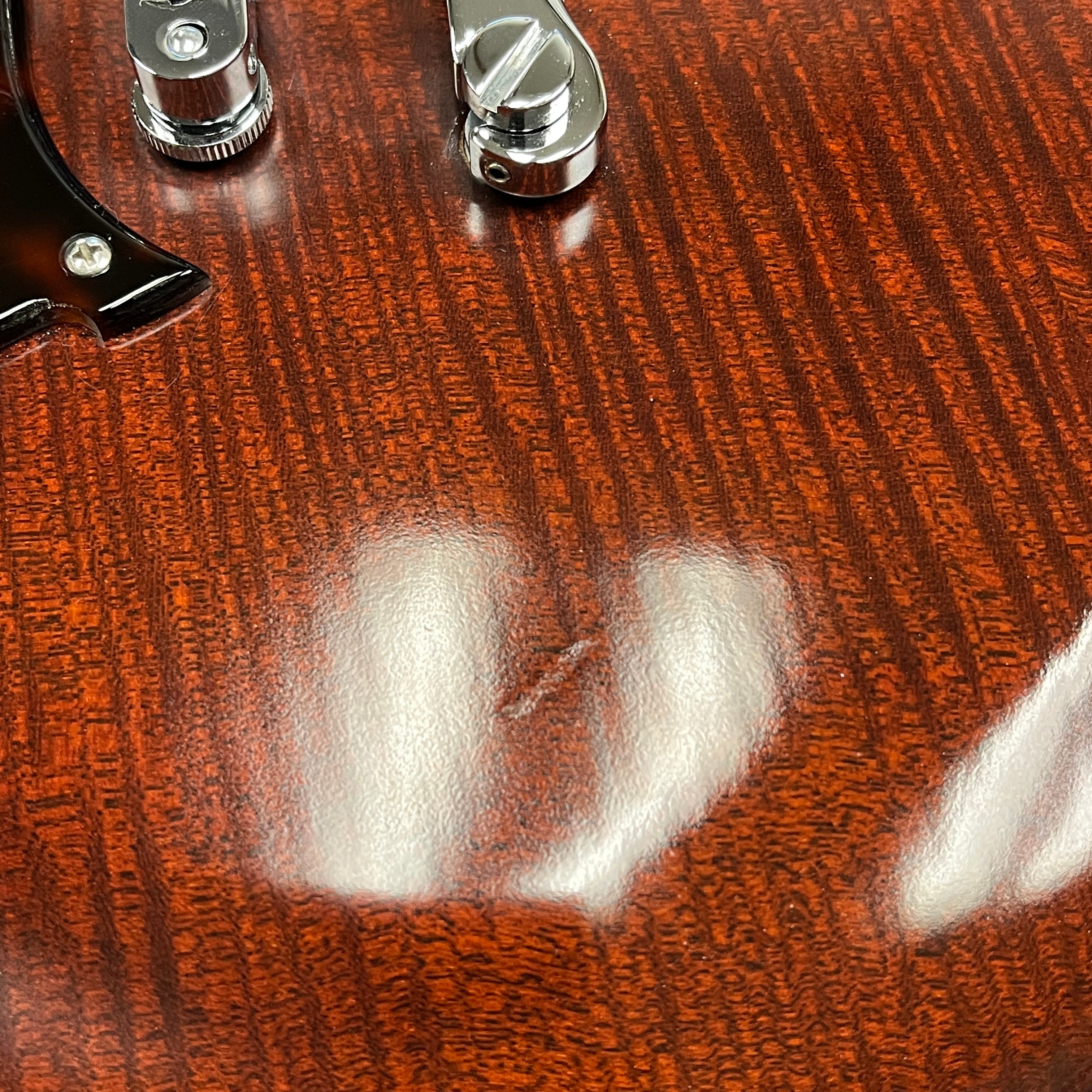 Scott Walker Phoenix mahogany electric guitar with chrome hardware and figured wood grain detail