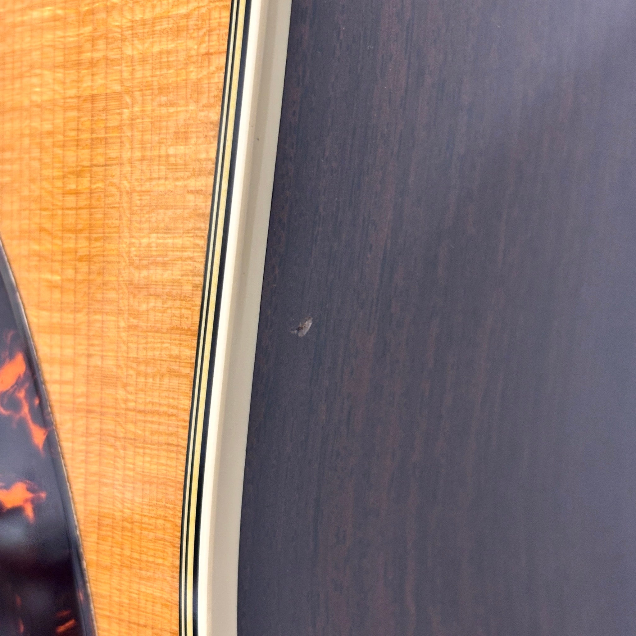 Martin D-28 acoustic dreadnought guitar Aging Toner finish with flamed top binding and rosewood back and sides detail