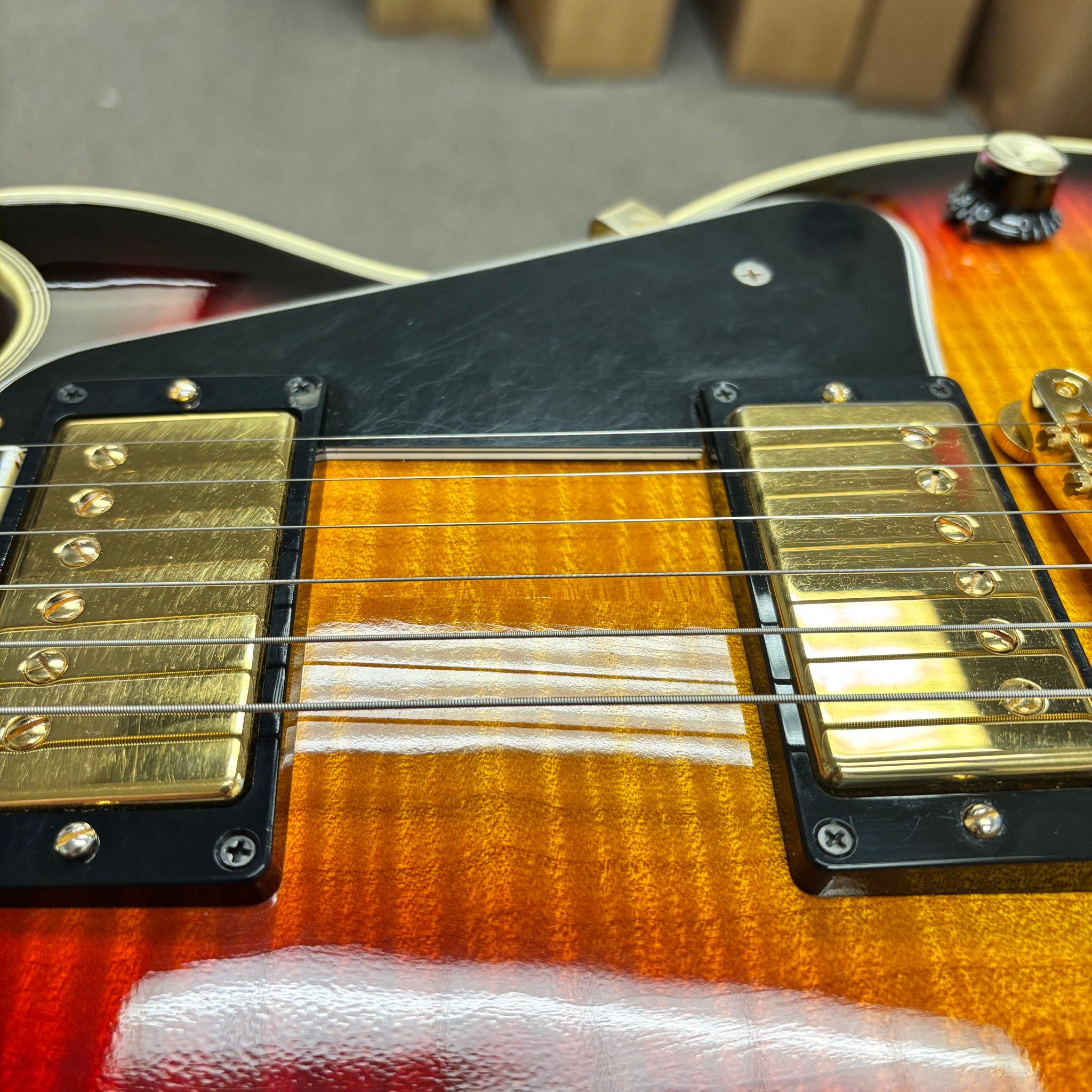 Gibson 68 Les Paul Custom Figured electric guitar Tri-Burst with dual gold humbuckers and flamed maple top