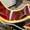 Gibson 68 Les Paul Custom Figured Tri-Burst electric guitar close-up showing cream body binding and cherry finish