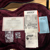 Gretsch G6136T-59 Vintage Select Falcon case interior with warranty card, guitar guide, and FilterTron pickup pamphlet