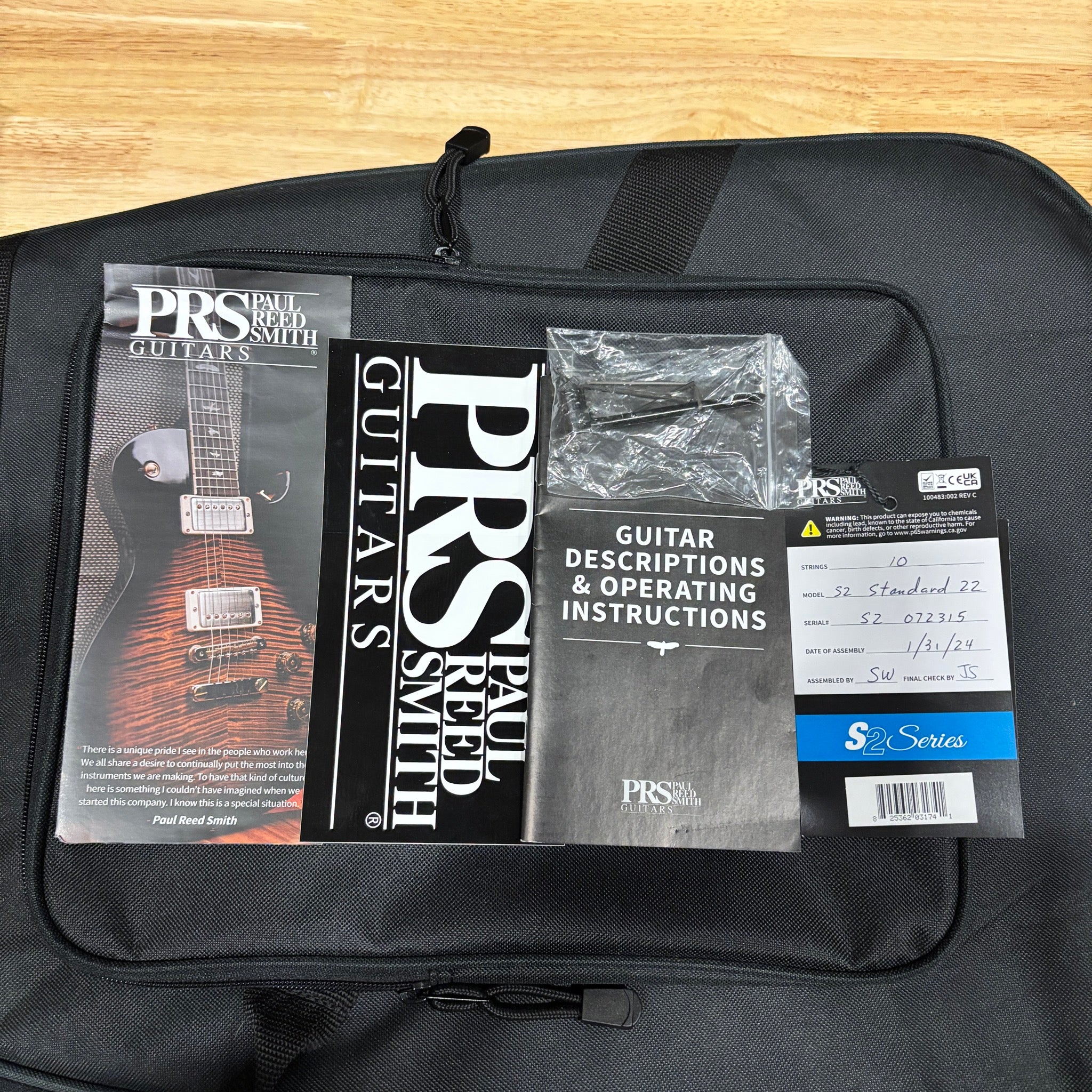 PRS Paul Reed Smith S2 Standard 22 Vintage Cherry gig bag with manuals, documentation, and accessories