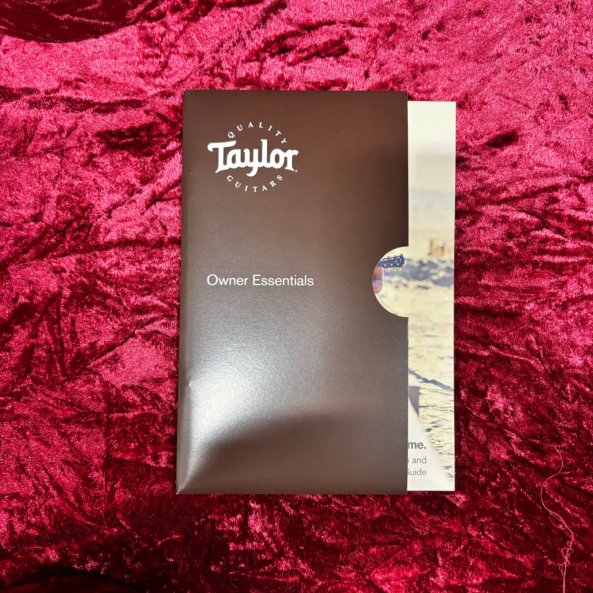 Taylor 414ce Next Generation Natural guitar Owner Essentials packet with brown booklet and registration guide