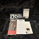 PRS Paul Reed Smith McCarty 594 Satin Black guitar documentation package with warranty card, manual, and keys