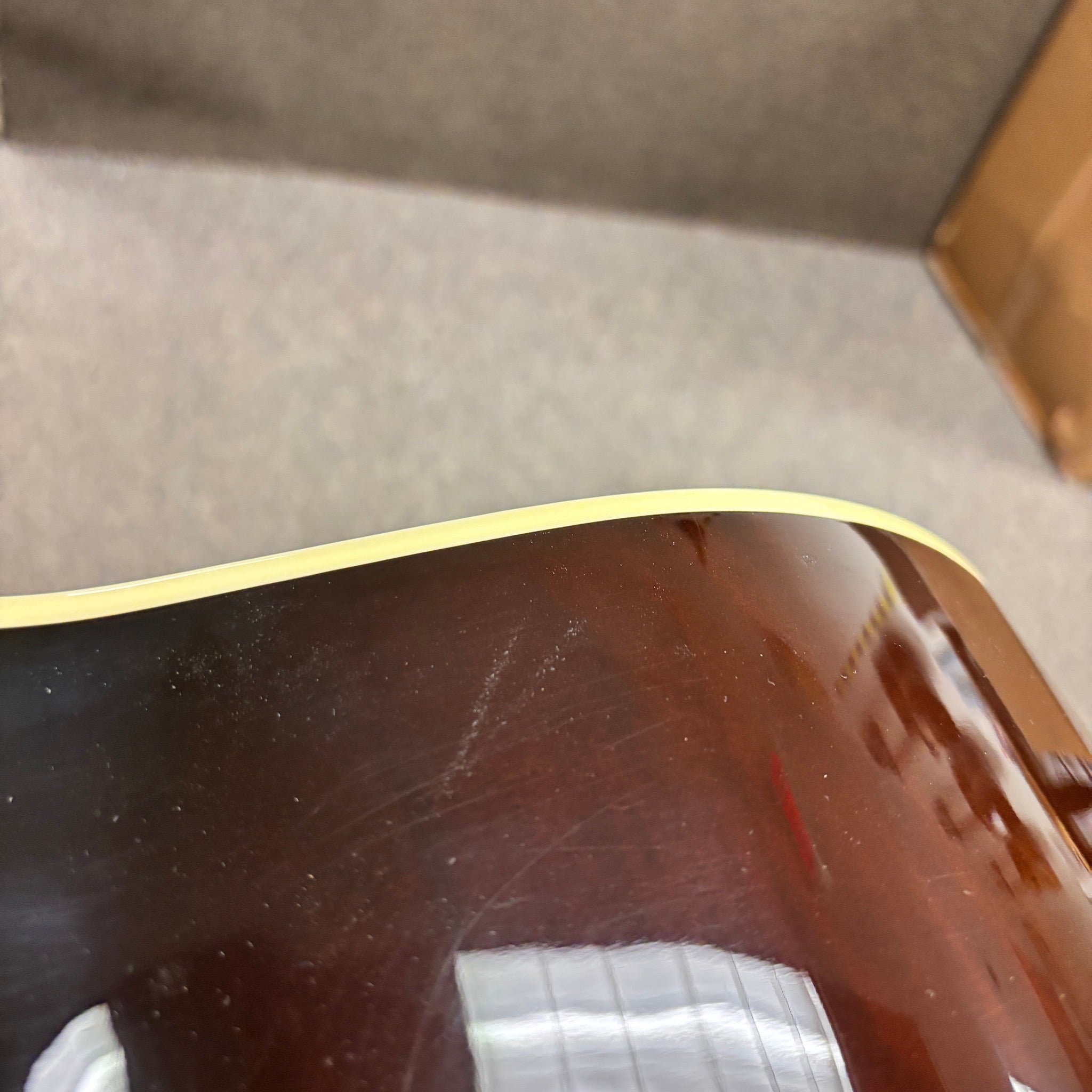 Gibson SJ-200 Standard acoustic jumbo guitar Sunburst finish with cream body binding close-up detail view