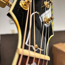 Gibson SJ-200 Standard acoustic guitar Sunburst closeup headstock with gold tuners and cream binding