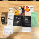Gibson Joe Bonamassa Aged Les Paul Goldtop accessories bundle with Certificate of Authenticity, Ernie Ball strap, and manuals