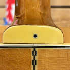 Epiphone FT-570BL acoustic guitar Natural finish close-up of neck heel joint with checkered inlay and cream binding