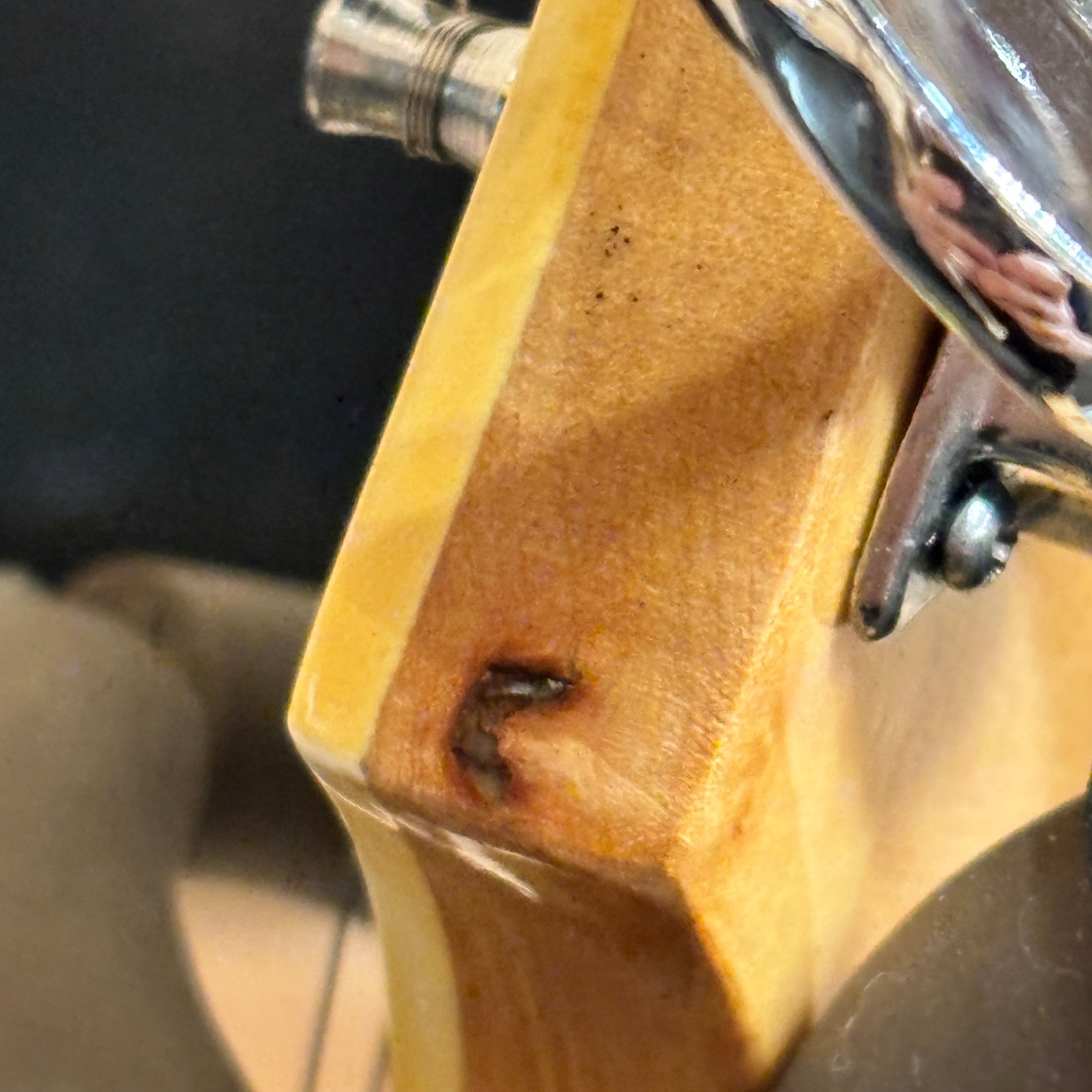 Epiphone FT-570BL acoustic guitar Natural finish close-up of neck heel joint showing wear and chrome hardware
