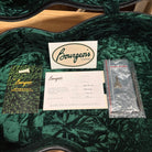 Bourgeois Touchstone Soloist OMC Natural guitar case interior with warranty card, sticker, and accessories