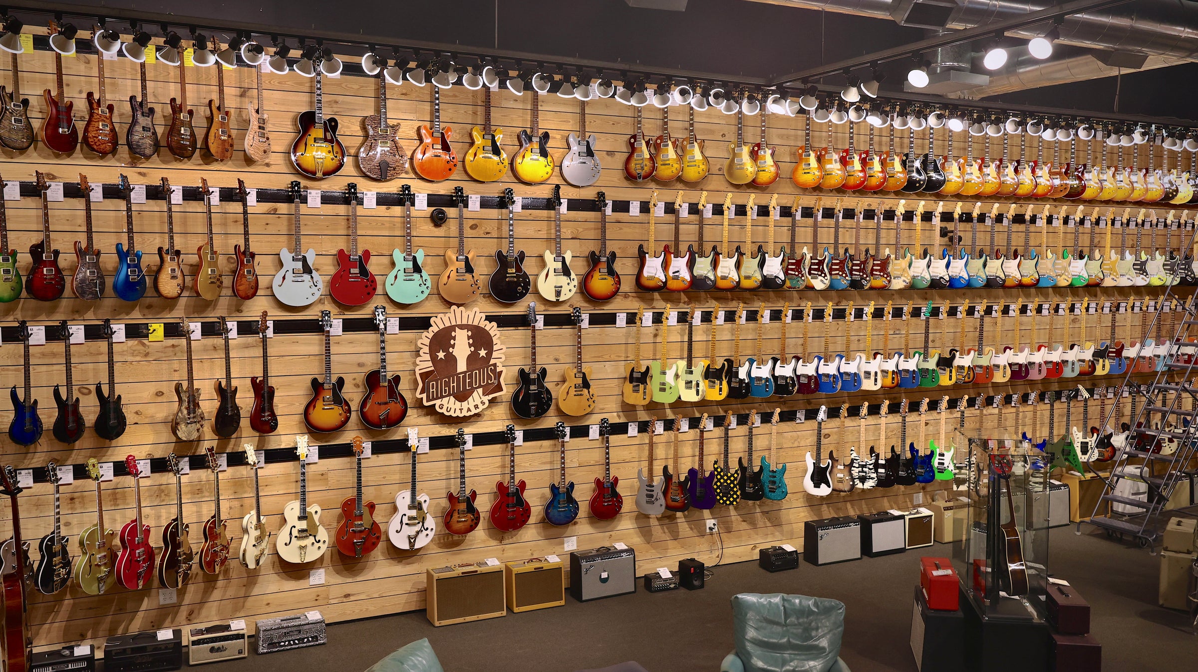 Righteous Guitars showroom in Roswell, GA - panoramic view of the main electric guitar wall