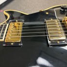 Pre-owned Gibson 1988 Les Paul Custom ebony electric guitar with gold humbucker pickups