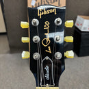 Pre-owned Gibson Les Paul Studio 100th Anniversary electric guitar wine red with gold hardware and yellow tuning pegs