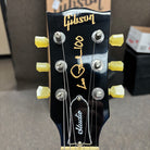 Pre-owned Gibson Les Paul Studio 100th Anniversary electric guitar wine red with gold hardware and yellow tuning pegs