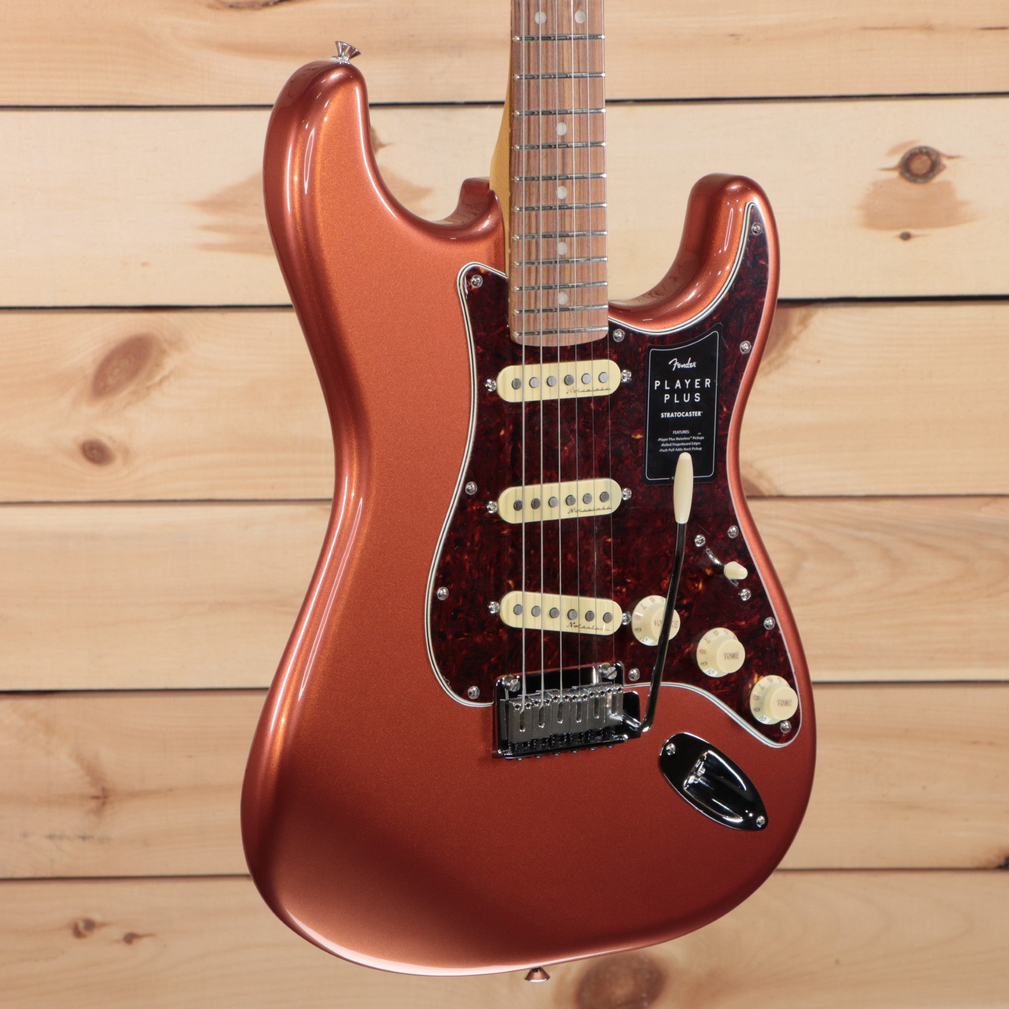 Fender Player Plus Stratocaster electric guitar Aged Candy Apple Red with single-coil pickups and tortoiseshell pickguard