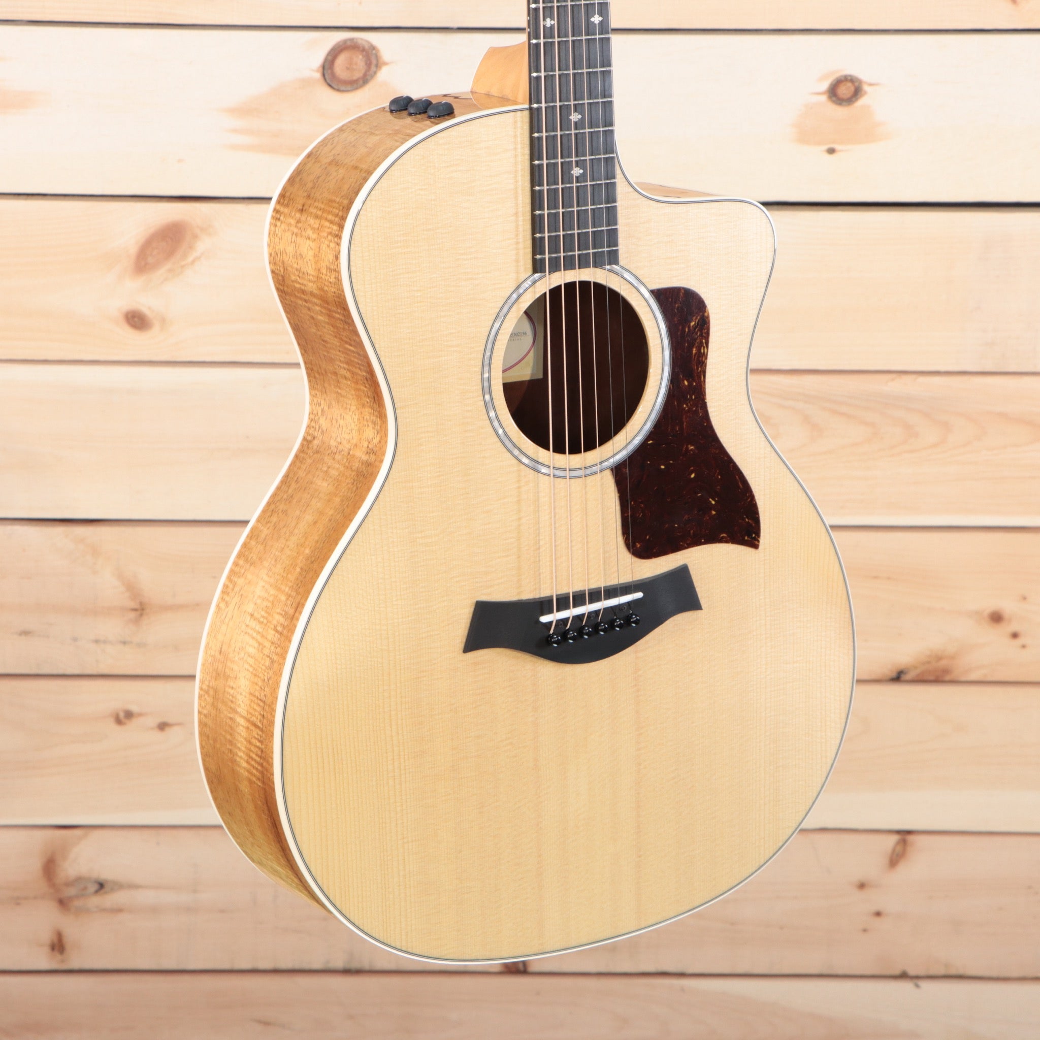 Taylor 214ce-K Dlx acoustic-electric guitar natural finish with venetian cutaway and koa back