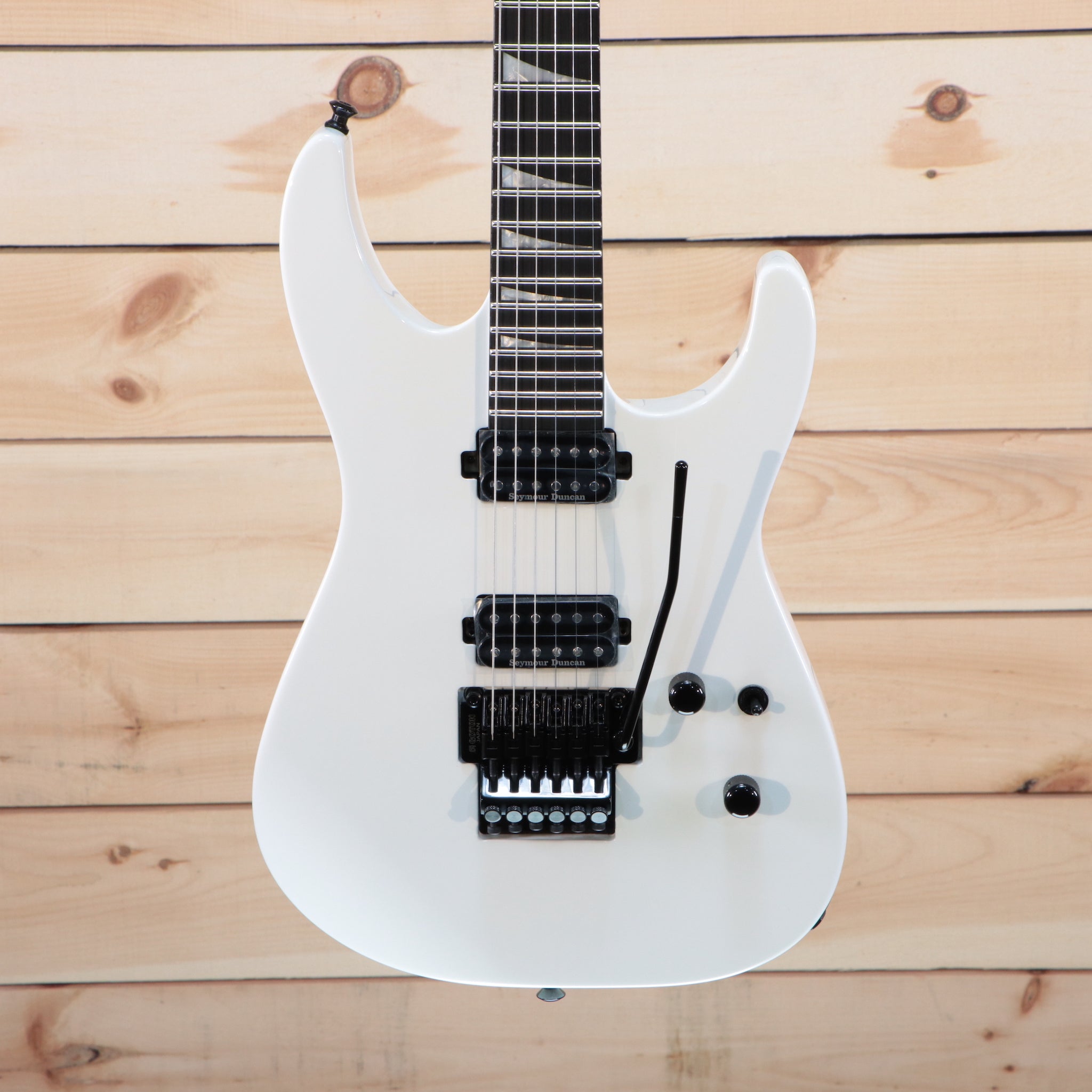Jackson MJ Series Soloist SL2 electric guitar Snow White with dual humbucker pickups and Floyd Rose tremolo