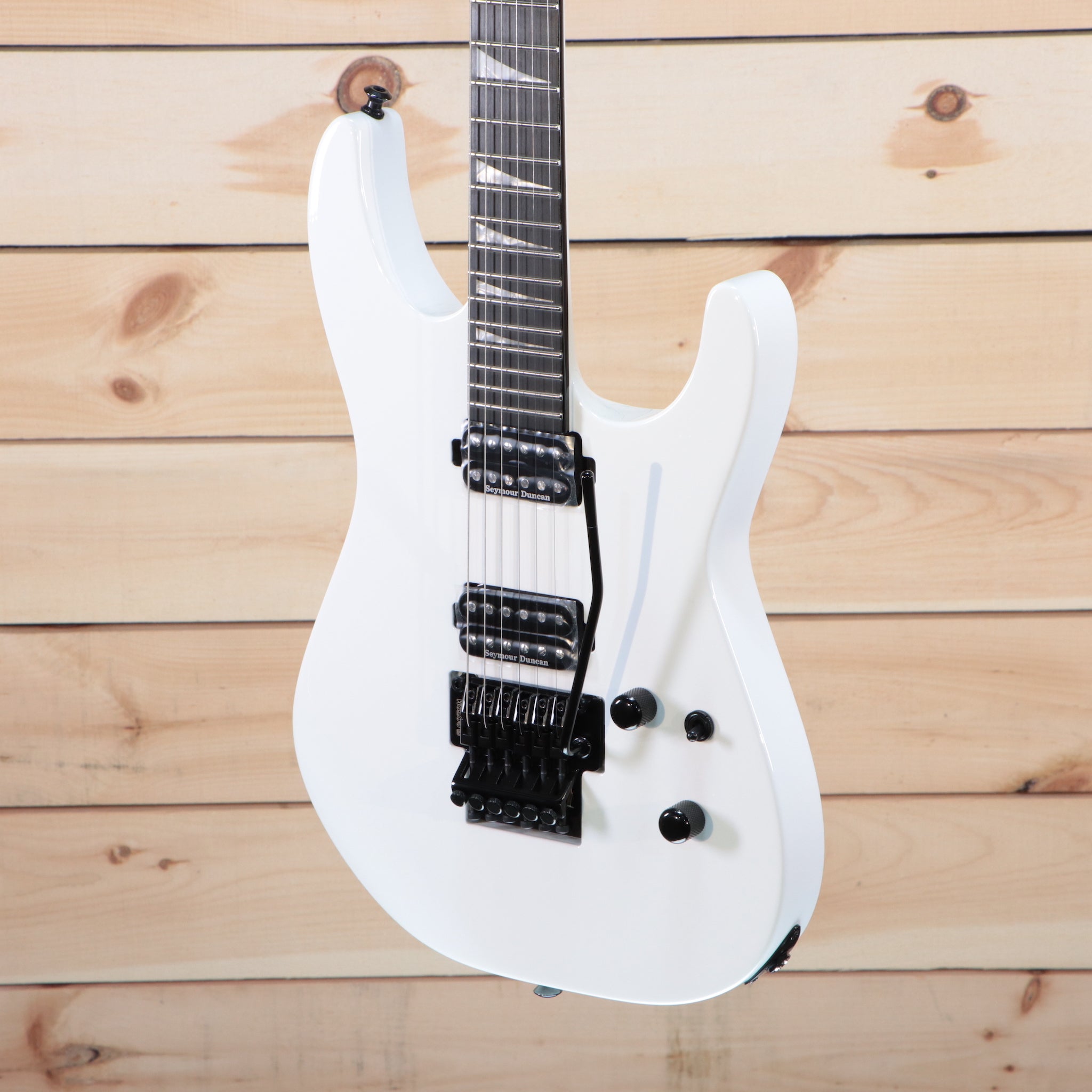 Jackson MJ Series Soloist SL2 electric guitar Snow White with dual humbucker pickups and Floyd Rose tremolo
