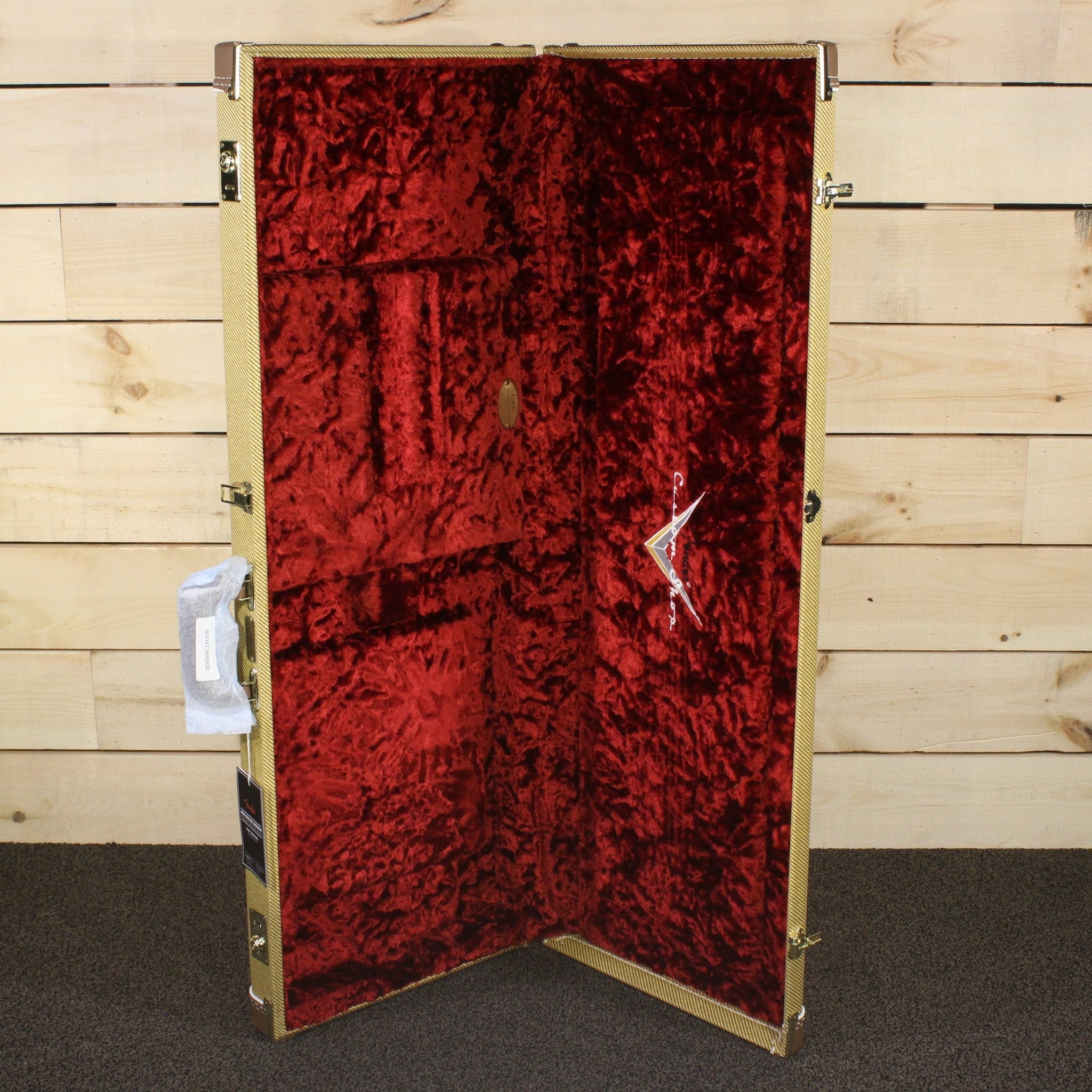 Fender Limited 1955 Telecaster Relic tweed hardshell case open showing red crushed velvet interior