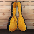 Gibson 1964 Trini Lopez VOS electric guitar hardshell case open with gold hardware latches and yellow plush interior
