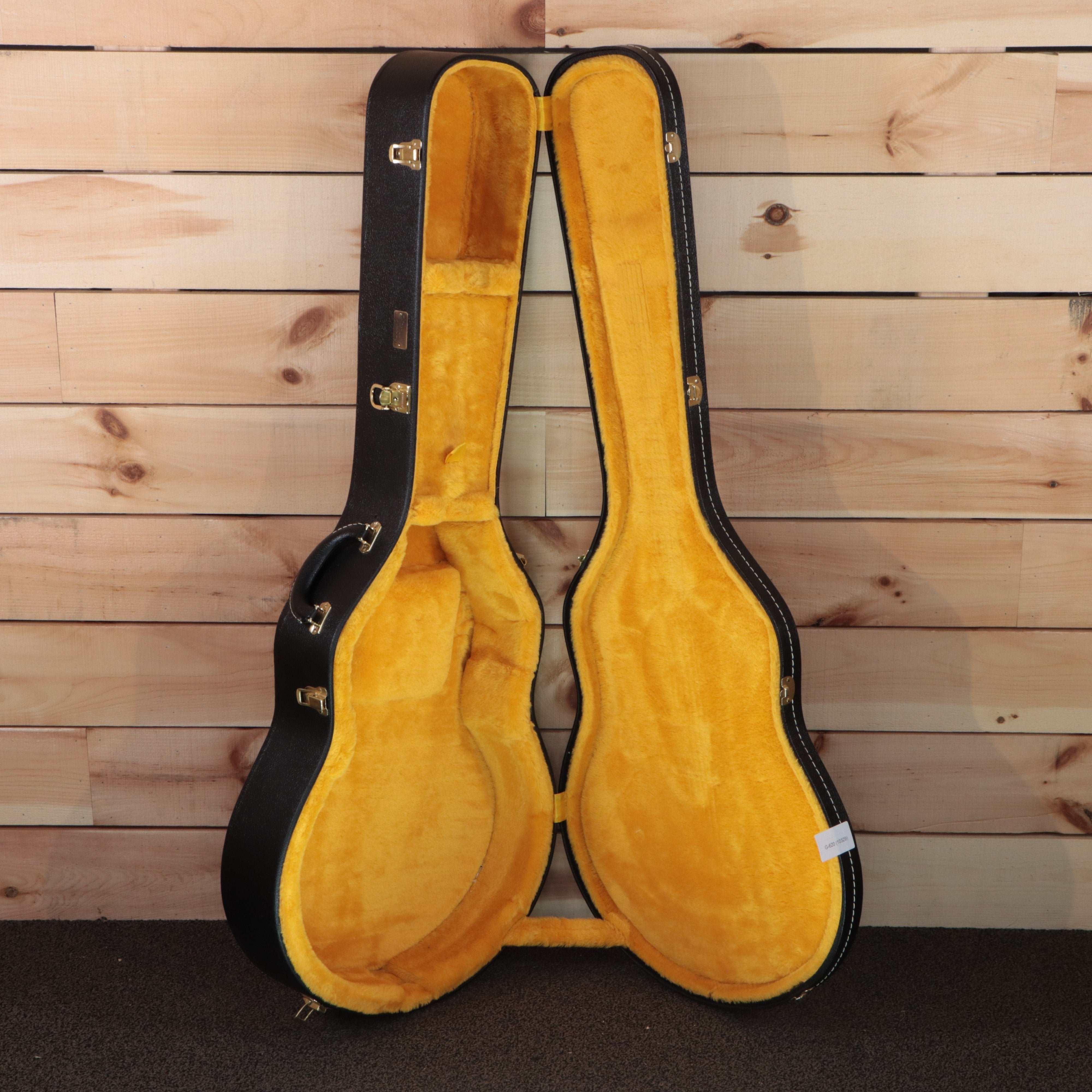 Gibson 1964 Trini Lopez VOS electric guitar hardshell case open with gold hardware latches and yellow plush interior